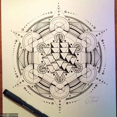 a drawing of an intricate design on paper