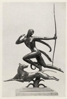 a statue of a woman holding a bow and two animals