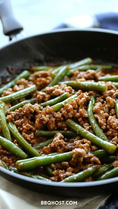 green beans with ground meat in a skillet