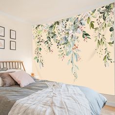 a bedroom with a large wall mural behind the bed