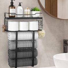 a bathroom shelf with towels and soaps on it