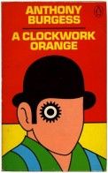 an orange and black book cover with a man's face in the middle of it