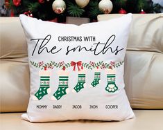 a christmas pillow sitting on top of a couch