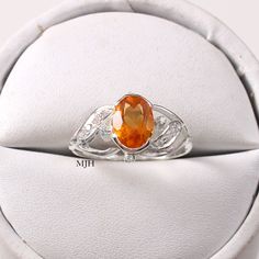 Oval Citrine Birthstone Ring With Accent Stones, Oval Citrine Crystal Promise Ring, Oval Amber Topaz Ring, Orange Oval Sapphire Gemstone Ring, Oval Citrine Birthstone Ring With Center Stone, Orange Oval Sapphire Ring, Oval Citrine Birthstone Crystal Ring, Oval Citrine Crystal Ring With Birthstone, Oval Citrine Promise Ring