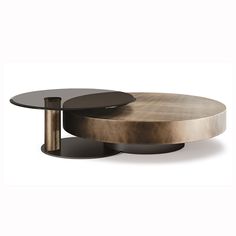 the table is made from metal and has two circular tables on each side, one with a