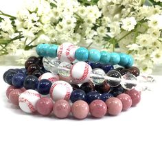 "✦Handmade item ✦Material: gemstone and plastic baseball bead ✦Shape: Round ✦Bead size: 8mm ✦Bracelet length: 7.5\" ( Fit with 6.75\" wrist size) ✦QTY: 1 pc / package Celebrate your love for the game with our 8mm Gemstone Baseball Mom Sport Bracelet. A perfect accessory for baseball enthusiasts and moms who support their athletes. These stretchy bracelets are versatile, making them ideal for girls, boys, women, and men. Whether you're cheering from the stands or showing your team spirit, this bracelet is a great addition to your style. This list is for one 7.5\" bracelet that comes with the bead you chose and one baseball bead. Your bracelet will arrive in an organza drawstring gift bag and perfect for gift giving. Our bracelet standard size is 7.5\" length which fits with 6.75\" wrist. Fr Drawstring Gift Bag, Sports Bracelet, Stretchy Bracelets, Baseball Mom, Girl Mom, Stocking Stuffer, Team Spirit, Round Beads, Gift Giving