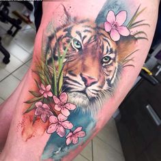 a tiger with flowers on his leg