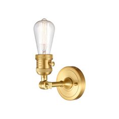 an antique brass finish wall light with a clear glass bulb on the front and side