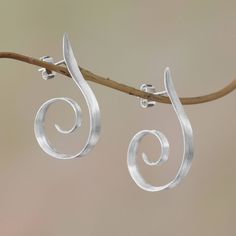 Curling below the ears spiral shapes are handcrafted of sterling silver in this pair of half-hoop earrings from Bali. Desi Antari designs these awe-inspiring earrings which are accentuated by a brushed-satin finish. Silver Chandelier Earrings, Silver Jewelry Design, Light My Fire, Jewelry Picture, Earrings Inspiration, Minimal Jewelry, Silver Work, Kefir, Jewelry Packaging