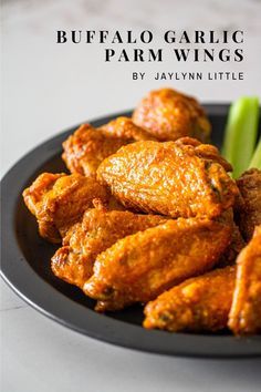 buffalo garlic and parmesan wings on a black plate