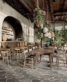 an indoor dining area with wooden tables and chairs, potted plants hanging from the ceiling