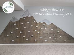 there is a mural in the corner of this room that says hubby's how to diy mountain climbing wall