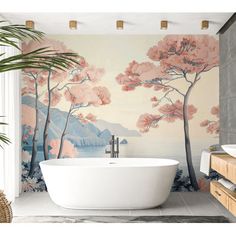 a bath tub sitting next to a wall with trees painted on the side of it