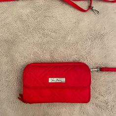 Never Used. In Excellent Condition. Has Two Straps , One Shirt And One Long. Red Travel Wallet With Cell Phone Pocket, Trendy Red Wallet With Cell Phone Pocket, Red Wallets With Mobile Phone Bag, Red Crossbody Travel Wallet, Red Travel Wallets With Removable Pouch, Red Travel Wallet With Removable Pouch, Chic Red Wallet For Everyday Use, Chic Red Everyday Wallet, Casual Red Travel Wallet