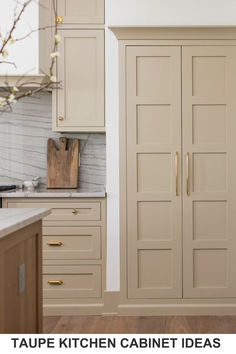 an image of a kitchen with cabinets and marble counter tops on the wall, along with text overlay that reads taupe kitchen cabinet ideas