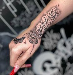 a woman's hand with a tattoo on it and the word merrim written in cursive writing