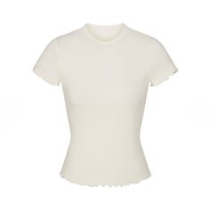 Skims Logo Pointelle T-Shirt W. Ruffle Edge *New With Tags* Description: Ruffle Edge On Bottom Hem, Standard Length Color: Marble Fabric: 96% Cotton/ 4% Spandex Fit: Model Is Size 2 And 5' 10”, Wearing Skims S Chic White Stretch T-shirt, White Fitted Top With Ruffles, White Ruffled Crew Neck T-shirt, Chic Fitted T-shirt With Ruffles, White Ruffled Short Sleeve T-shirt, Chic White Fitted T-shirt, Fitted Ruffle Crew Neck T-shirt, Fitted Crew Neck T-shirt With Ruffles, Fitted Ruffled Crew Neck T-shirt