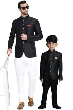 VASTRAMAY Black Silk Blend Solid Baap Beta Jodhpuri Set Look dapper in this black silk blend jodhpuri set from Vastramay. Perfect for special occasions, this set includes a jacket and pants for both father and son. Features Black, woven design Regular fit Mandarin collar Long sleeves Full button placket One welt pocket Straight hem Includes pocket square Specifications Sleeve Length: Long sleeves Top Shape: Regular Top Hemline: Straight Neck: Mandarin Material & Care Material: Silk Blend Care: Dry Clean Only Legal Disclaimer: The product is guaranteed to be 100% genuine. Product images are for illustrative purposes only. Images/packaging/ labels may vary from time to time due to changes made by the manufacturer's manufacturing batch and location. The product description is for information Semi-formal Long Sleeve Sets For Diwali, Black Fitted Kurta For Diwali, Black Sherwani With Pallu For Festivals, Black Formal Kurta For Festivals, Black Dabka Sets For Diwali, Black Long Sleeve Kurta For Formal Occasions, Traditional Black Long Sleeve Sets, Formal Long Sleeve Black Kurta, Fitted Black Festive Sets