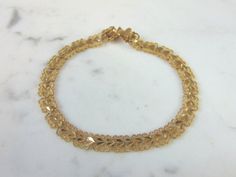 "FOR SALE IS A VINTAGE ESTATE 10K YELLOW GOLD HEART FILIGREE BRACELET. THE BRACELET MEASURES 7 5/8\" LONG FROM THE CLASP BY 1/4\" WIDE, AND WEIGHS 6.8g. CONDITION IS VERY GOOD. THIS WOULD MAKE A LOVELY GIFT AND IS A GREAT VALUE FOR THE MONEY. IF ANY OTHER QUESTIONS, PLEASE ASK. BE SURE TO CHECK OUT SOME OF MY OTHER GREAT ITEMS UP FOR SALE. THANK YOU" Classic Gold Heart Bracelet For Wedding, Formal Yellow Gold Heart Jubilee Bracelet, Vintage Gold Bracelet With Intricate Design For Anniversary, Vintage Gold Bracelet For Anniversary With Intricate Design, Yellow Gold Filigree Bracelet For Anniversary, Yellow Gold Filigree Bracelets For Anniversary, Vintage Gold Heart Bracelet For Anniversary, Anniversary Yellow Gold Filigree Bracelet, Gold Filigree Bracelet For Anniversary