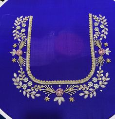 a blue plate with white and gold designs on it