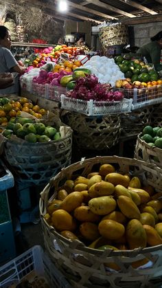 several baskets filled with different types of fruit