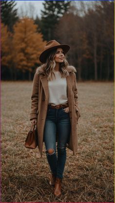 Discover the best fall outfit inspirations to elevate your style this season. This chic ensemble features a cozy fur-trimmed coat, perfect for staying warm during chilly autumn days. Paired with a classic white sweater, distressed jeans, and stylish brown ankle boots, this look is ideal for any fall activity. The brown fedora and matching handbag add a touch of elegance and ensure you are ready for any occasion. Visit our site now for more fashionable fall outfit ideas and transform your wardrobe today!#FallOutfitInspirations #FallFashion #AutumnStyle #ChicFallLooks #FashionTrends #SeasonalStyle #OutfitIdeas Smoky Mountains Outfits Fall, Ankle Boots Jeans Outfit, Fall Mountain Outfit, Autumn Outfit Women, Wearing Ankle Boots, Fedora Outfit