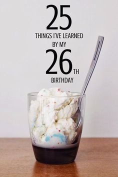 a person holding a spoon in front of a cup with ice cream on it and the words 25 things i've learned by my 26 th birthday