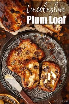 some food is sitting on a plate with the words unclushfire plum loaf