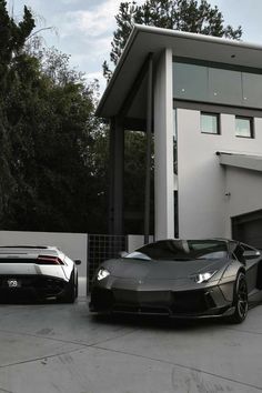 two cars parked in front of a house