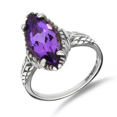 "**All photos are professionally photographed in our in-house studio, and are of the exact item you will receive.** **All measurements done in inches are rounded to the nearest 1/8\". ** From designer Kabana comes this 4.25ct marquise amethyst sterling silver ring. Metal Type: Sterling Silver Hallmarks: Sterling Copywrite Mark, Kabana Metal Finish: High Polish Ring Size: 6 Setting: Prong Item Weight: 3.80 grams Center Gemstone Gemstone: Amethyst Carat Weight: 4.25 ct Shape: Marquise Gemstone Mea Elegant Purple Amethyst Ring With Marquise Cut, Elegant Purple Marquise Cut Amethyst Ring, Silver Marquise Jewelry With Gemstone Accents, Silver Jewelry With Gemstone Accents In Marquise Shape, Silver Jewelry With Marquise Gemstone Accents, Classic Marquise Jewelry With Accent Stones, Marquise Amethyst Jewelry With Accent Stones, Elegant Amethyst Marquise Ring, Purple Marquise Gemstone Jewelry