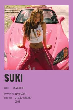 a woman standing in front of a pink car with the words suki above her