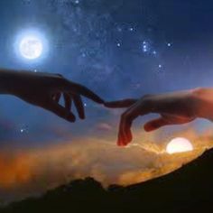 two hands reaching out towards each other in front of the sky with stars and planets