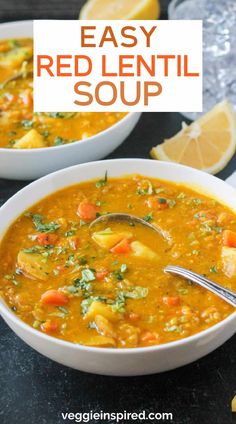 two bowls of red lentil soup with lemons and parsley on the side