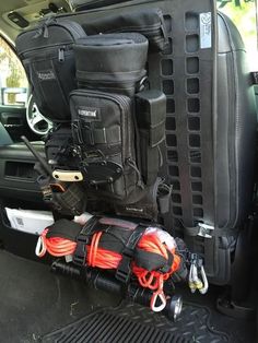 there are many items in the back of this truck that is loaded with gear and equipment