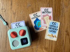 three children's toys sitting on top of a wooden table