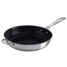 an empty frying pan on a white background