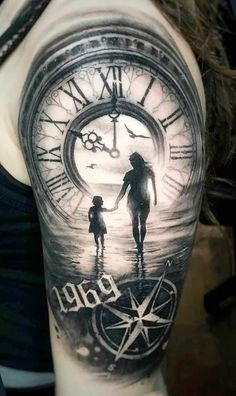 a woman with a tattoo on her arm holding the hand of a child in front of a clock