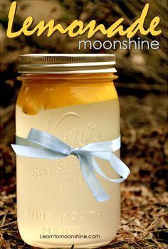 a jar filled with lemonade sitting on top of a table