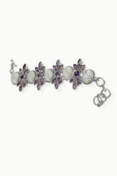 Elegance takes true form with our Moonstone and Amethyst Bracelet - Stellar. This beautiful bracelet incorporates breathtaking large oval Moonstones aligned with sparkling genuine Amethyst Gemstones. Work this statement piece with any outfit, no matter how chic or casual. Complete your look with an extra pop of sparkle by pairing this bracelet with one of our Moonstone necklaces. Authentic Sivalya Rainbow Moonstone Hallmarked Metal: 925 Sterling Silver Adjustable Length: 7.5" - 8.5" Links Moonst White Oval Fusion Style Jewelry, White Oval Fusion Jewelry, White Amethyst Jewelry With Gemstone Accents, Elegant Amethyst Crystal Bracelet With Stones, White Oval Gemstone Bracelet, Elegant Purple Moonstone Jewelry, White Amethyst Bracelet With Natural Stones, Elegant Amethyst Crystal Bracelet With Natural Stones, Elegant Amethyst Gemstone Crystal Bracelet