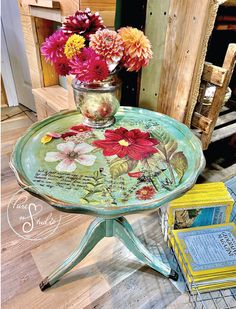 a glass table with flowers on it