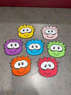 the sesame street gang stickers are all different colors and sizes, with faces drawn on them