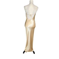 This Dress Has Some Very Light Fabric Pulls Not Visible When Worn. Please Check Last Two Pictures. Elevate Your Elegance With This Vintage Gold Satin Slip Dress. Its Fluid Lines And Luxurious Fabric Make It An Exquisite Addition To Any Wardrobe. Spaghetti Straps Low Back Satin Material Vintage Style >Slinky >Classic Slip Gown, Formal Evening Wear, Luxury Satin Dress, Cocktail Dress, Evening Slip, Vintage Slip Dress, Gold Formal Dress, Satin Gold Dress Size: Womens M Gold Satin Slip Dress, Satin Gold Dress, Gold Fitted Satin Slip Dress, Elegant Gold Satin Slip Dress, Fitted Backless Slip Dress With Built-in Bra, Formal Dress Satin, Backless Slip Dress With Built-in Bra, Gold Satin V-neck Slip Dress, Slip Gown