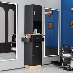 a barber shop with chairs and mirrors in the room, one chair is up against the wall