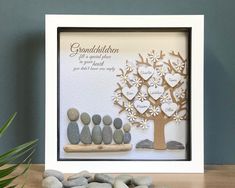 a family tree made out of rocks and paper