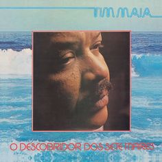 an album cover with a man's face in the water and waves behind him