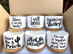 six ceramic bowls in a box with sayings on the inside and outside, including one that says i'm not a prick