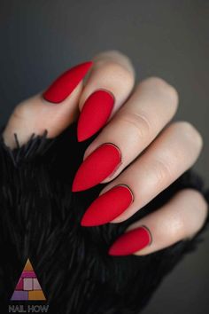 These matte red nails with black accents are perfect for an edgy and stylish fall look. The sharp contrast makes them pop. Check out more unique nail designs at NailHow.com and save this pin for your next manicure! Pointed Red Nails, Sharp Red Nails, Short Red Stiletto Nails, Black Red Stiletto Nails, Deep Red Stiletto Nails, Black And Red Sharp Nails, Lilac Nails Design, Red Matte Nails