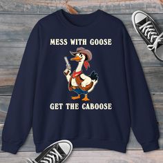 Get ready to rock a hilarious and unique look with our Silly Goose Western-themed sweatshirts and hoodies! 🤠🦢 These comfy, eye-catching designs are perfect for anyone who loves to laugh and stand out from the crowd. Whether you're a fan of memes, TikTok trends, or just appreciate a good chuckle, our silly goose gear has got you covered. Show off your wild side with a touch of Western flair that'll make you the talk of the town. These sweatshirts and hoodies are ideal for casual hangouts, game Funny Fan Merchandise Tops With Long Sleeves, Funny Long Sleeve Tops For Fan Merchandise, Funny Long Sleeve Fan Merchandise Top, Funny Cotton Hoodie Sweatshirt, Funny Print Sweatshirt For Fall, Funny Long Sleeve Cotton Hoodie, Funny Crew Neck Sweatshirt With Print, Funny Text Long Sleeve Cotton Sweatshirt, Novelty Cotton Crew Neck Sweatshirt