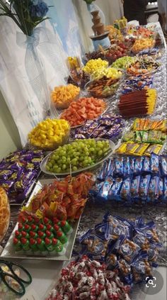 a buffet table filled with lots of different types of candy and candies on it