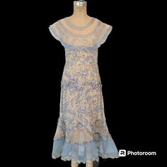 Lovely late 1920s/cuspy to early 1930s pullover day dress made up of near sheer floral print cotton (voile?) and organdy in a blush beige and sky blue. Small at the bust (to fit 32/33) with a roomier waist and kicky flare towards and at the hem. Freshly hand laundered and air-dried and ready to wear.  No issues.  The ruched or ruffled trim could be fluff steamed a bit more. Sleeveless with an oversized portrait collar. A whisper light ethereal day dress in excellent condition. Shown on a 32-23-33 form. Fits well but the style/cut of the dress allows for a little more room at the waist and hips. The fit should skim, not be fitted.  Dress measurements are taken outside of the garment while flat.  Your measurements should be a little smaller.  Across the front of the bust while flat, just to Sleeveless Vintage Dress For Spring Events, 1920s Day Dress, To Wear, Dress Measurements, Cotton Voile, Day Dress, Dress Sleeveless, Fast Fashion, Dress Clothes For Women